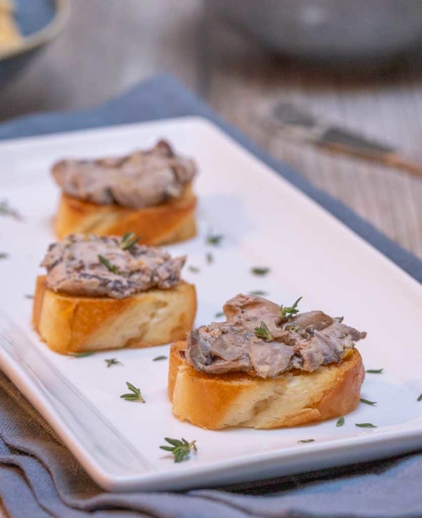 White rectangular serving tray showing three portions of Mushroom Pate