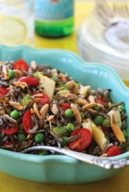 Oval blue bowl filled with Elegant Wild Rice Salad with Parmesan Vinaigrette